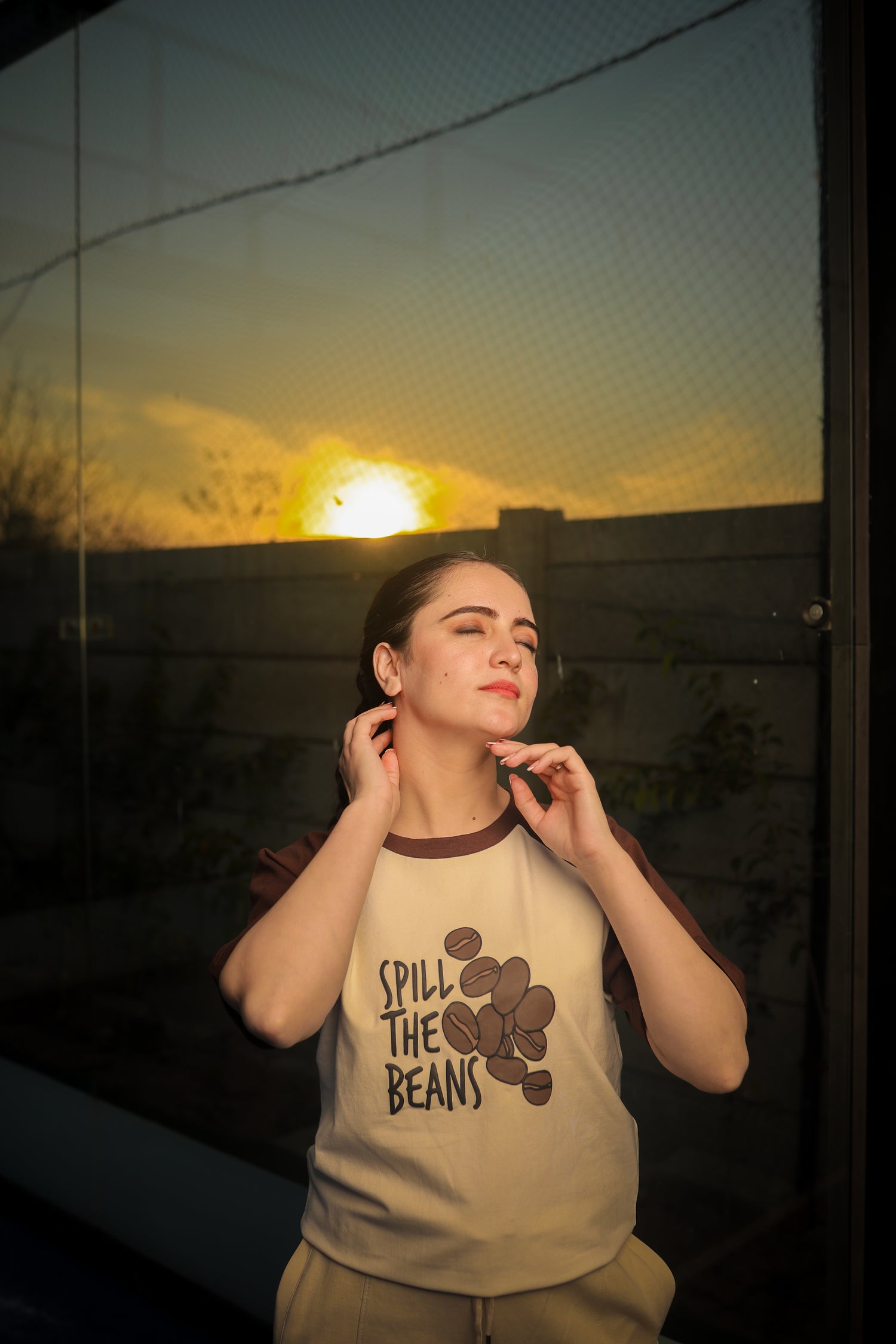 Model wearing Spill The Beans ELUX streetwear t-shirt