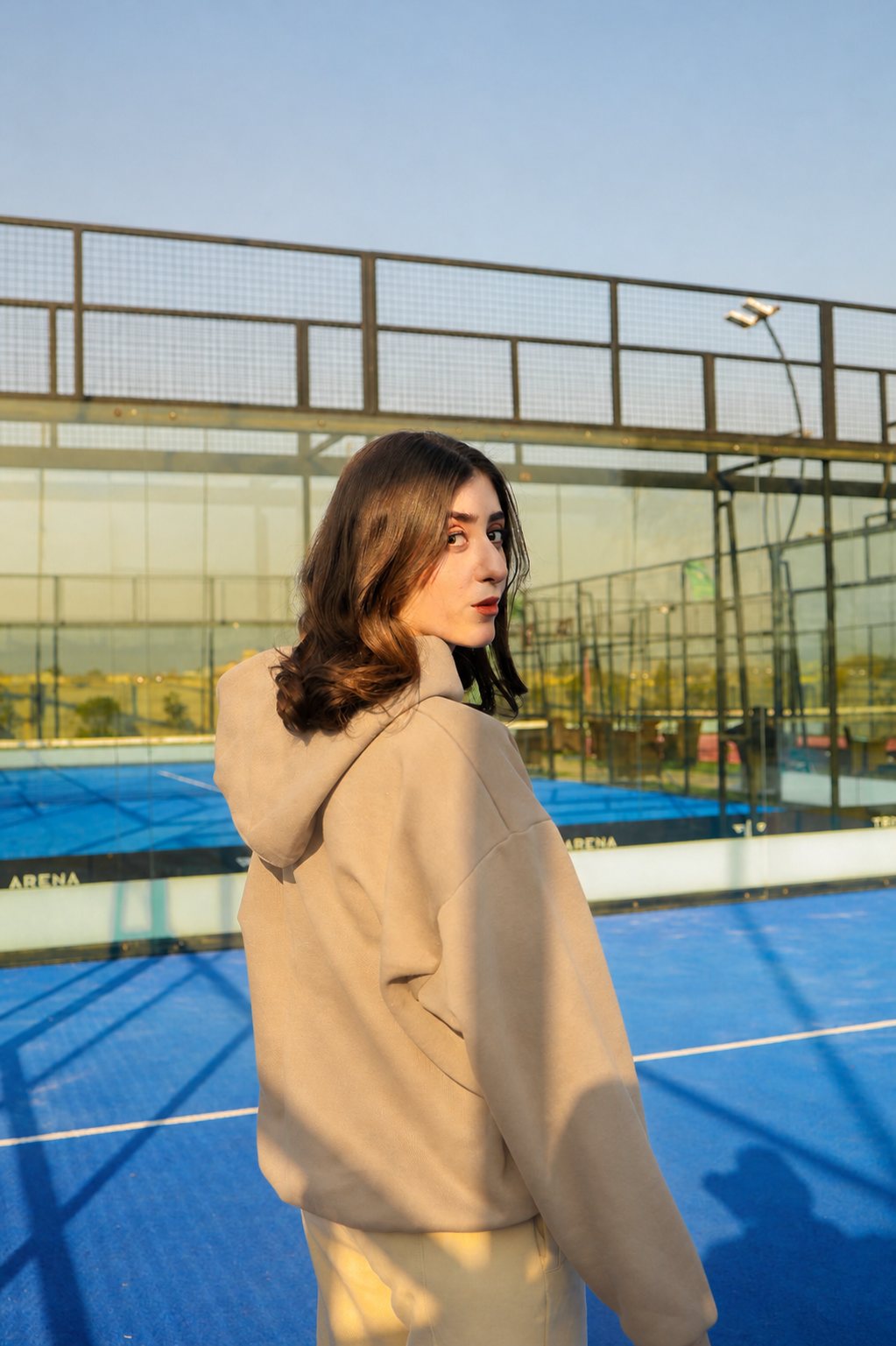 Back view of ELUX oversized hoodie in beige with clean minimal streetwear aesthetic